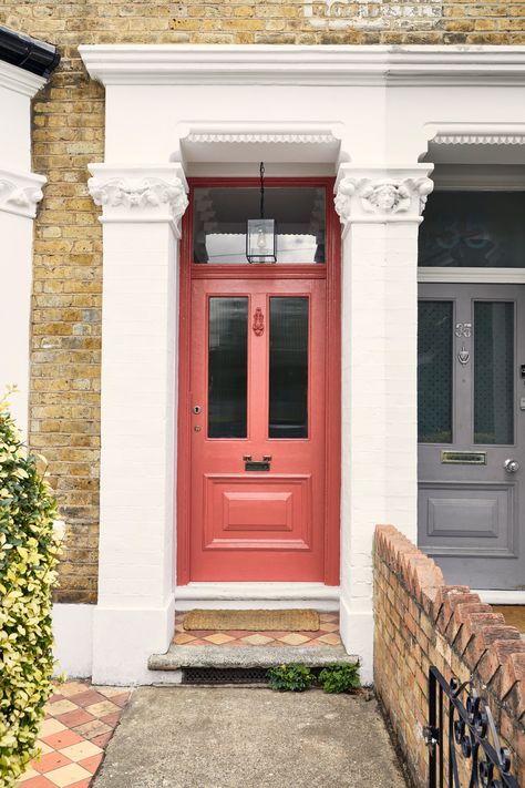 The grandeur of a Victorian property demands a front door colour that enhances the beauty of the building. With the right colour and a complementing paint finish, your front door will really let your style and personality sing. Mortlake Red™ No.290 pictured here, a dusty pastel, slightly terracotta red paint. This shade is slightly muted, yet unique in tone and vibrant in appearance. Click the link to read more on 'Choosing a front door paint for a Victorian home.' #Mylands #HouseOfColour Painted Front Door Ideas, Coral Front Doors, Mylands Paint, Bright Front Doors, Victorian Front Door, Orange Front Doors, Front Door Paint, Victorian Front Doors, Unique Front Doors