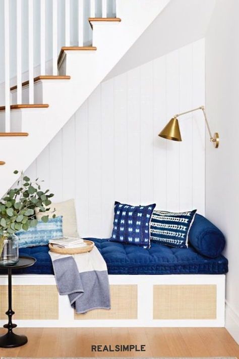 These Zero-Effort IKEA Hacks Look Like a Million Bucks | In the 2020 Real Simple Home, a BESTA TV stand transforms into a cozy reading nook. Thanks to trendy cane doors from Norse Interiors, the built-in storage is hidden out of sight. #pantryorganization #realsimple #organizingtips #organization #kitchenorganization Ikea Reading Nook Hack, Ikea Hack Reading Nook, Ikea Reading Nook, Tv Nook Ideas, Reading Nook Ikea, Built In Reading Nook, Norse Interiors, Besta Tv, Trendy Paint Colors