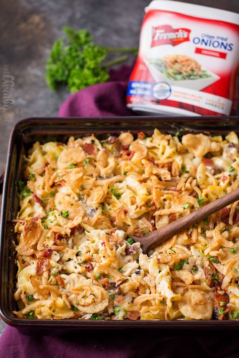 Loaded Cheesy Chicken Noodle Casserole | This chicken noodle casserole has great classic chicken noodle flavors, with some added flavors like bacon, mushrooms, and a crunchy fried onion topping!  Great for a make-ahead meal, this casserole will be family favorite! | The Chunky Chef | #chickennoodle #chickencasserole #casserole #makeahead #comfortfoods #weeknightmeals Chicken And Cheese Noodle Bake, Cheesy Chicken And Noodle Casserole, French Onion Chicken Noodle Casserole, Loaded Cheesy Chicken Noodle Casserole, Chicken Mushroom Noodle Casserole, Chicken Egg Noodle Casserole, Cheesy Chicken Noodle Casserole, Chicken Noodle Bake, Chicken Noodle Casserole Recipe