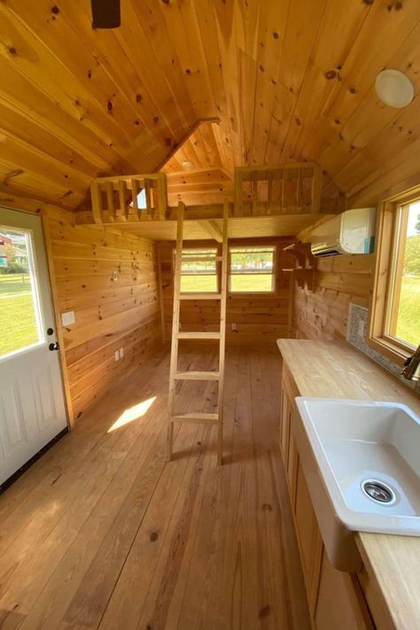 The 28' Freedom is the ultimate tiny cabin on wheels with wood everywhere and two lofts, a large bathroom, kitchen, and living room! This tiny house for sale has two sleeping areas and is the ultimate cabin in the woods everyone wants but can take anywhere! Tiny Homes On Wheels Interior, Diy Tiny Cabin, Cabin On Wheels, Galvanized Metal Roof, Loft Staircase, Large Bathroom, Tiny House For Sale, Small Sink, Wall Mounted Sink