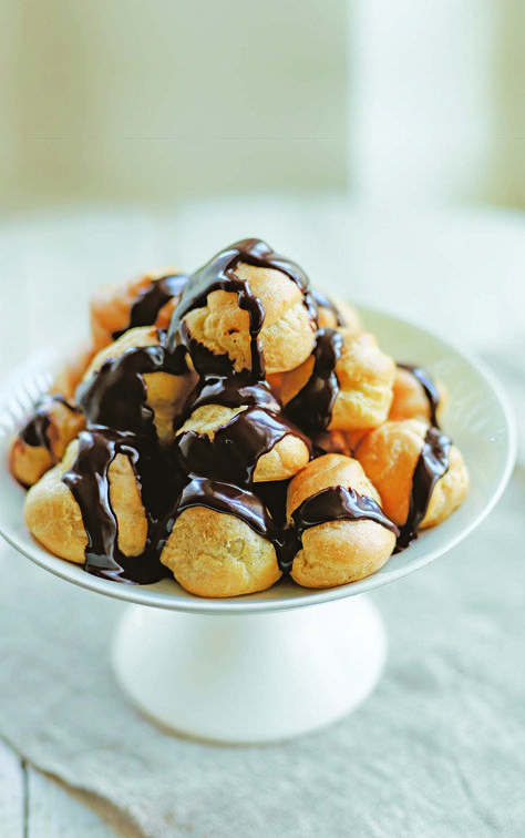 Profiteroles with chocolate sauce by Rosemary Shrager Delicious Magazine Recipes, Profiteroles Recipe, Neapolitan Ice Cream, Delicious Magazine, Choux Pastry, Chocolate Sauce, Eclairs, Seasoning Recipes, Christmas Desserts