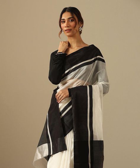 If the quiet luxury era has anything to say, it's that perennial styles like an iconic black and white saree will forever have a spot in our hearts and in our wardrobes.� Featured here is our White Handloom Pure Silk Chanderi Saree With Black Mashroo Border. This saree with its 'Ek Naliya' weave offers a delicate texture that gracefully envelops the wearer.� Explore our new edit of Chanderi Sarees online at www.weaverstory.com or at our stores For appointments, Call/ Whatsapp: +91 981064634... Black And White Saree, Chanderi Sarees, Chanderi Saree, White Saree, Black Saree, Cream Silk, Quiet Luxury, Saree Look, The Quiet