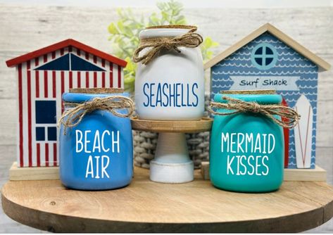 Beach Tiered Tray Summer Nautical Tiered Tray Beach Decor Summer Decor Coastal Decor Seashells Jar Mermaid Kisses Jar by SweetBeanFarmhouse on Etsy Cricut Beach Decor, Beach Theme Shelves, Beach Tiered Tray Decor, Pool Tiered Tray Decor, Bathroom Beach Theme, Beach Jar, Resin Beach Tray, Decorative Glass Jars, Beach Bathroom Decor