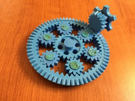 Designed and printed for my one year old niece Ava, this gear set has a 90 degree drive bevel.  Can you figure out how many turns the drive gear makes to spin the other gears around once?   Great desktop curio or learning toy!  Note that it takes a day or two to print all the pieces, allowing for mistakes and whatnot. Kinetic Lamp, Blender Software, Cogs And Gears, Maker Faire, Pattern Sketch, 3d Printing Business, 3d Printing Diy, 3d Printing Ideas, 3d Printing Projects