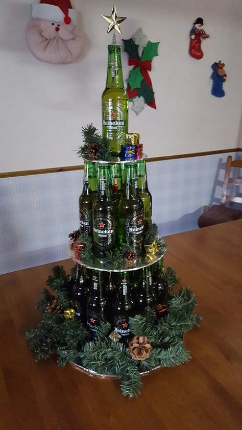 Beer bottle Christmas Tree Beer Bottle Christmas Tree, Wine Bottle Christmas Tree Diy, Christmas Tree Wine Bottle, Christmas Tree Beer Cans, Beer Tree Christmas, Mini Liquor Bottle Christmas Tree, Alcohol Christmas Tree, Beer Can Christmas Tree, Beer Christmas Tree