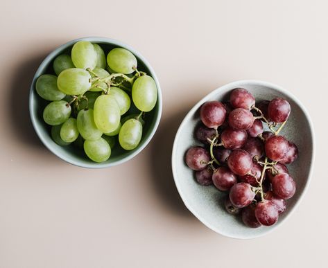 To learn more about how to store grapes, we spoke with an expert on the topic to find the best way to store grapes so you can keep yours fresh for as long as possible. Storing Grapes, Can You Freeze Grapes, Grapes In Containers, How To Store Grapes, Mason Jar Storage, Frozen Grapes, Refreshing Snacks, Growing Grapes, Red Grapes