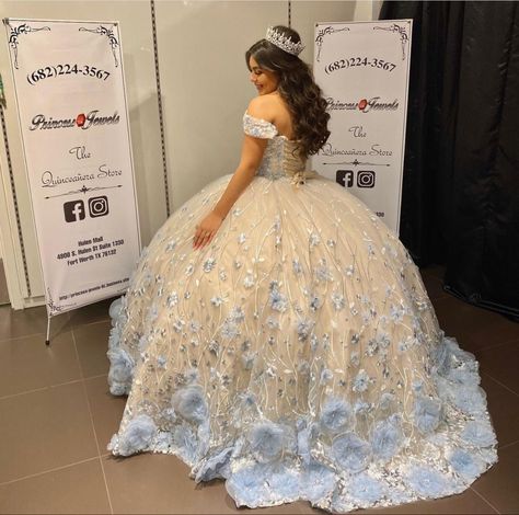 White Quince Dress With Blue Flowers, Rare Quince Dresses, White And Blue Quince Dress, Cream White Quinceanera Dresses, White Sweet Sixteen Dresses, Blue And White Quince Dress, Quinceanera Dresses Cream, White And Blue Quinceanera Dresses, White Quince Dress With Flowers