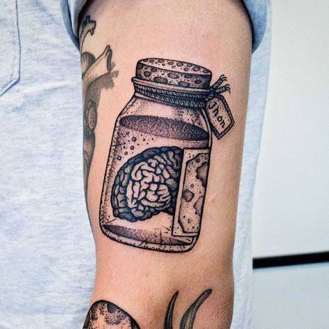 Brain in a jar tattoo inked on the left arm Brain In A Jar, Psychology Tattoo, Dark Tattoo Ideas, Jar Tattoo, Anatomy Tattoo, Feminine Skull Tattoos, Places To Get Tattoos, About Brain, Brain Tattoo