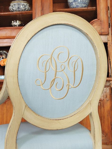 Soft blue fabric is paired with white distressed wood for a traditional dining room chair. A script monogram adds an elegant touch to the oval backed chair. Traditional Dining Room Chairs, Monogram Chair, Designers Portfolio, Island Chairs, Monogrammed Linens, Traditional Dining Rooms, Italian Decor, Traditional Dining, Bottle Wall