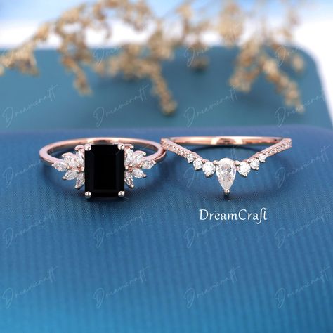 Vintage Black Onyx Engagement Ring Sets Rose Gold Emerald Cut Moissanite Ring Engagement Ring Unique Wedding Bridal Promise Ring --->Ring details: - Theme:Romantic Wedding & Engagement - Metal Type: 14K White Gold,14K Rose Gold,14K Yellow Gold - Engagement Ring: - Center stone: 2.0CT Black onyx - Side stone: Natural and conflict-free diamonds - Side stone:0.30ctw - Color: G-H - Clarity: SI-VS - Wedding band - Natural and conflict-free diamonds - Side stone:0.391ctw - Color: G-H - Clarity: Black Onyx Engagement Ring Rose Gold, Black Onyx Wedding Ring, Black And Rose Gold Engagement Ring, Black Gem Engagement Rings, Unique Black Engagement Rings, Emerald Cut Engagement Ring With Wedding Band, Black And Gold Wedding Ring, Emerald Cut Engagement Ring Set, Emerald Cut Moissanite Ring