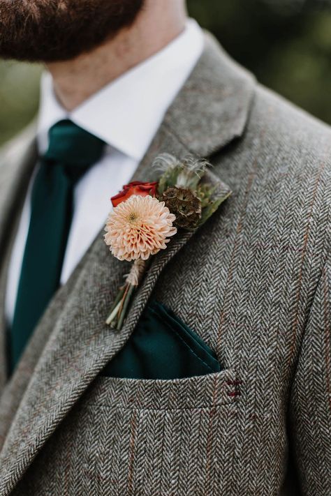 Groom in a grey tweed suit with a dark forest green tie and pocket square and a pink and red flower buttonhole Groomsmen Tweed Suits, Wedding Suit With Green Tie, Tweed Wedding Suits Groomsmen, Dark Green Tweed Wedding Suit, Wedding Suit Inspiration, Dark Grey Suit Green Tie, Tweed Suits Men Wedding, Dark Grey Suit With Green Tie, Dark Grey Suit Wedding