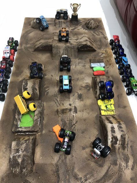 Monster Jam Birthday Activities, Monster Jam Activities, Monster Truck Course Diy, Monster Jam Party Games, Cardboard Monster Truck Track, Monster Truck Arena Ideas, Monster Truck Obstacle Course, Diy Monster Jam Arena, Monster Truck Play Area