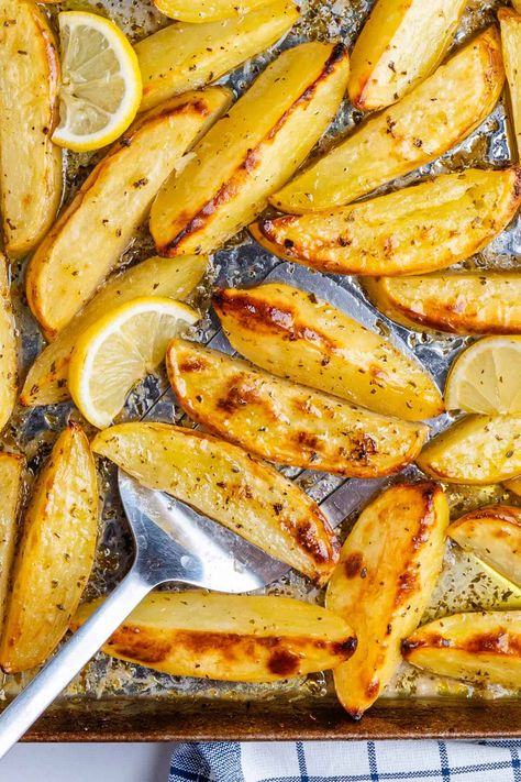 These Greek Lemon Potatoes aren't your regular potatoes. Roasted in a lemony broth, they're soft and tender with crispy edges. This is a side dish to impress! Wedge Potatoes, Greek Roasted Potatoes, Starchy Sides, Greek Chicken And Potatoes, Parmesan Crusted Potatoes, Greek Lemon Potatoes, Potatoes Roasted, Savory Sides, Greek Potatoes