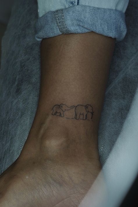 Animal tattoo, mini tattoo, family tattoo, minimalistic tattoo, elephant, elephant tattoo, small tattoo, nice tattoo, tiny tattoo, ideas for tattoo Tiny Elephant Tattoos For Women, Elephant Ankle Tattoo, Dainty Elephant Tattoo, Matching Elephant Tattoos, Tiny Animal Tattoos, Tattoo Ideas Elephant, Elephants Tattoo, Safari Tattoo, Small Elephant Tattoo