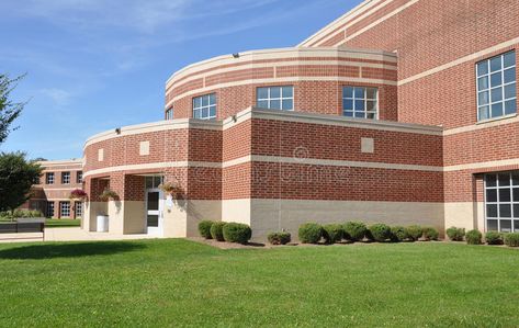 Modern high school. Exterior of a modern brick high school by a lush green lawn #Sponsored , #sponsored, #ADVERTISEMENT, #school, #Modern, #green, #Exterior