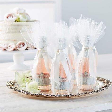 Special guests deserve special favors, so we made these tulle-wrapped champagne splits. They’re sophisticated, but oh-so-easy to put together. A little ribbon and a little tulle are all you need!  Make these DIY Tulle Champagne Bottle Wedding Favors in just a few steps Beautiful Wedding Centerpiece, How To Dress For A Wedding, Simple Wedding Flowers, Wedding Crashers, Wedding Mementos, Wedding Bottles, Unique Wedding Flowers, Wedding Floral Centerpieces, Wedding Favors Cheap