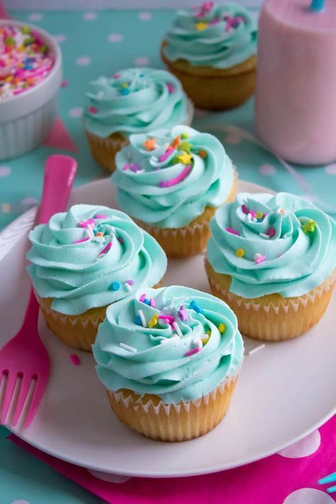 These Vanilla Cupcakes are light, fluffy and incredibly moist! Topped with a creamy and Dreamy Vanilla Buttercream, these are the best cupcakes for a birthday party or any event! Two Sweet Cupcakes, Fluffy Vanilla Cupcake Recipe, Creative Cupcake Recipes, Fluffy Vanilla Cupcakes, Vanilla Cupcake Recipe, Brownie Cupcakes, Creative Cupcakes, Salty Cake, Unicorn Cupcakes