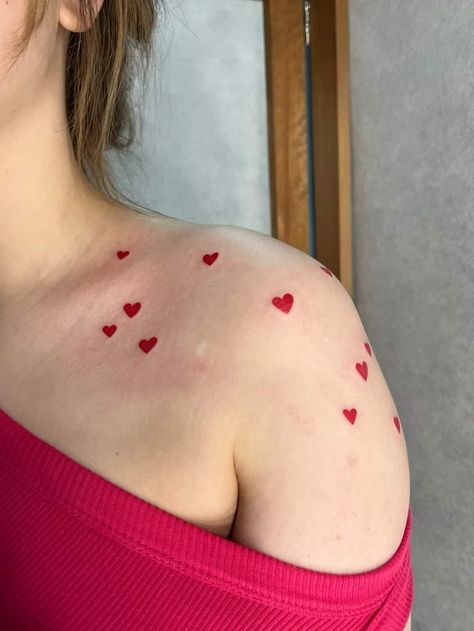 Tiny Colour Tattoo, Red Tattoo Collar Bone, Heart Tattoo Placement For Women, Red Tattoo Designs For Women, Colorful Girly Tattoos, Cute Tattoos Arm, Red Dot Tattoo, Little Red Heart Tattoo, Red Ink Tattoos On Dark Skin