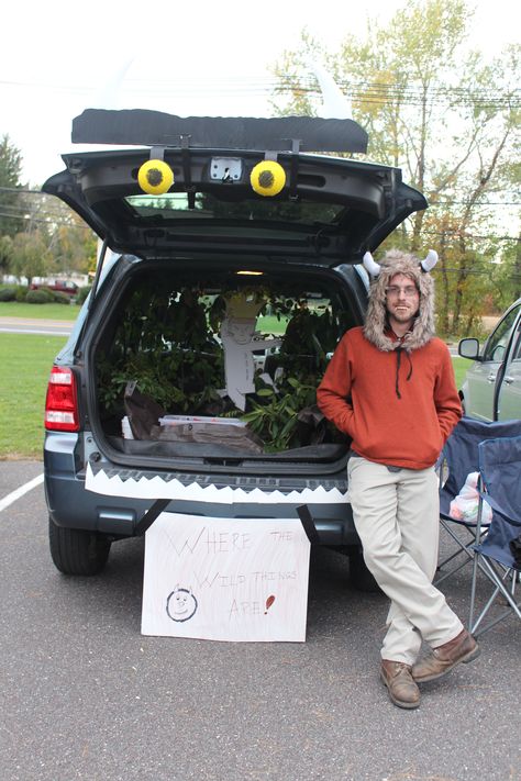 Debated on what to do for Trunk or Treat this year at my church.. Wanted to make it family friendly and as we stood in Walmart looking at all the craft supplies Josh suggested "Where the Wild Things Are". It was a blast putting it together! I drew Max on foam board, the horns and eyes are made of styrofoam and the rest is paper.. The trees were just branches he cut from his back yard. The kids and parents loved it! They kept telling us how it was their favorite book. Where The Wild Things Are Trunk Or Treat, Homemade Baby Costumes, Wild Things Costume, Nerd Halloween Costumes, Baby Boy Halloween, Teal Pumpkin, Fall Festivals, Costume Works