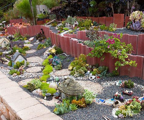 Place your miniature garden in an easily accessible location. Here, the village runs along the top of a knee-high block wall that elevates it for good viewing and makes it easy to reach into and putter with. Then, form hills and valleys to vary the landscapes by mounding or excavating soil, or creating terraces that add dimension. Succulent Fairy Garden, Miniature Garden Design, Outdoor Fairy Garden, Succulent Outdoor, Miniature Garden Decor, Window Box Plants, Cotswolds Cottage, Fairies Garden, Window Box Flowers