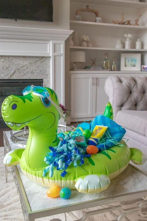 Pool Float Easter Baskets are a creative and fun idea for kids. Loaded with beach items and a fun Easter basket they will use through summer. #passion4savings #poolfloat #pool #beach #easter #basket #idea #useful #fun Pool Themed Easter Basket Ideas, Easter At The Beach, Creative Easter Basket Ideas, Beach Theme Easter Basket, Pool Easter Basket, Beach Gift Basket, Pool Gifts, Easter Basket Themes, Fun Easter Baskets