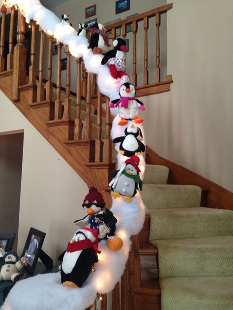 Penguin snow slide! I put garland down first, then lights, then fluffy snow. The garland helps attach the snow. I sewed a piece of thread through the back of each penguin and then around the banister to hold them upright. Staircase Decoration, Christmas Banister, Christmas Stairs Decorations, Christmas Stairs, Dinner Christmas, Christmas Staircase, Holiday Hack, Dekor Diy, Xmas Deco