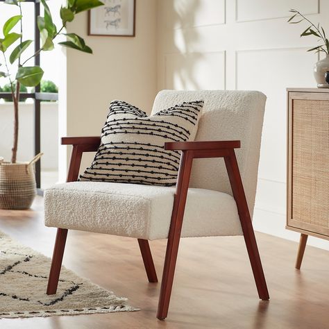 Alex is giving us real retro vibes! Mid century styling with a modern twist, the Alex armchair will certainly make a statement in your front room.Crafted from solid wood, Alex's sturdy frame will stand the test of time, making it perfect for daily use in your lounge, office or bedroom. Upholstered in on-trend cream boucle fabric, the spacious, padded seat cushion is made for your to sink into, while the gently reclined back will give you support in all the right places. Cream Armchair, Small Armchairs, Boucle Armchair, Pink Armchair, Scandinavian Armchair, Green Armchair, Contemporary Armchair, Grey Armchair, Mid Century Armchair