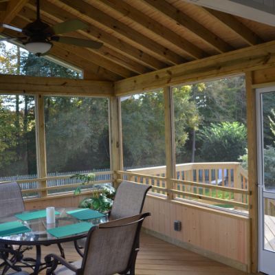 The knee wall on this bright and airy Raleigh porch is a perfect choice if you have pets or small children that can bust through screens. The rustic wood matches the ceiling and on the exterior, it matches the home’s siding. With a grill deck outside of this porch, the homeowners can still enjoy a cook-out or sunning themselves with the option to be in the insect, UV and rain protection provided by the porch. Porch Rain Protection, Porch Knee Wall, Knee Walls, Screened In Porch Diy, Screen Porches, Dream Porch, Porch Interior, Screened Porch Designs, Screened Porches