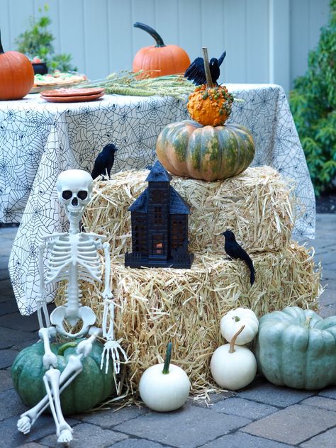 Who else loves carving pumpkins?! 🎃 While Halloween is definitely different this year, you can still make things feel festive with family or close friends. This year we dressed up our backyard with simple, spooky accents such as hay bales, a skeleton, pumpkins and a haunted house. Then, we set the table with this adorable spiderweb tablecloth and created a “carving station” at each corner with pumpkin carving tools. Just because we are at home doesn’t mean we can’t make it a frightful delight! Skeleton On Hay Bales, Fall Decor With Hay Bales, Pumpkin Carving Station, Spiderweb Tablecloth, Halloween Hay Bale, Pumpkin Hay Bale, Halloween Jelly, Pumpkin Guts, Yogurt Covered Pretzels