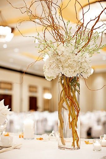 Tall centerpiece arrangement with hydrangeas, dendrobium orchids and curly willow. Centerpieces Simple, Branch Centerpieces Wedding, Wedding Branches, Winter Centerpieces, Curly Willow, White Hydrangeas, Willow Branches, Balloon Decor, Flower Arranging