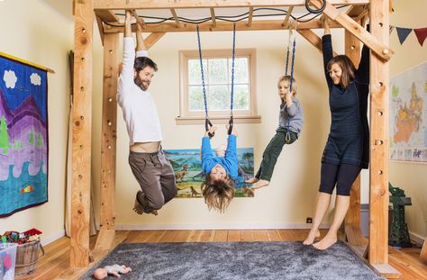 By keeping her kids' clothes and toys to a minimum and putting both beds (her kids share one) in the same room, Katy was able to free up space for an indoor jungle gym. They have no TV, no chairs &   no hang-ups about their unconventional home​. Kids Indoor Gym, Indoor Monkey Bars, Basement Gym Ideas, Indoor Jungle Gym, No Tv, Basement Playroom, Basement Gym, Gym Room At Home, Indoor Gym