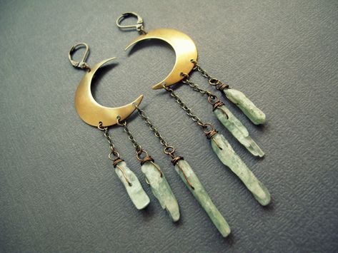 Green Kyanite Luna Earrings: Channel your inner goddess with these bold raw crystal moon earrings! You'll feel celestially radiant wherever you wear them! ✧ Raw gemstone dangles in your choice of green kyanite, blue kyanite, smoky quartz, clear quartz, rose quartz, or sea urchin spines ✧ Your choice of 4, 5, or 6 inch length ✧ Comfortable to wear at 5-8 grams each (slightly more than a US quarter) ✧ Crystal size 15-40mm long (not including wire wrap) ✧ Raw brass moons with aged brass chain and b Earrings Space, Space Earrings, Crescent Moon Jewelry, Kyanite Earrings, Green Kyanite, Raw Stone Earring, Kyanite Crystal, Earrings Moon, Space Jewelry