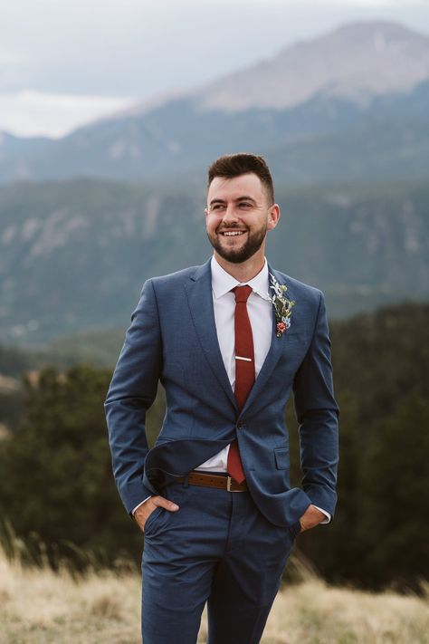 Groom in dark blue suit with maroon tie. Mountain hiking elopement with views of Pikes Peak outside Colorado Springs. Colorado elopement photographer. Navy Suit With Maroon Tie, Slate Blue Suit Groom, Navy Blue Groomsmen Suits Fall Wedding, Maroon Ties Groomsmen, Deep Blue Groomsmen Suits, Navy Blue Suit Rust Tie, Navy Suit Rust Tie Wedding, Blue Suit With Blue Tie, Blue Suit With Terracotta Tie