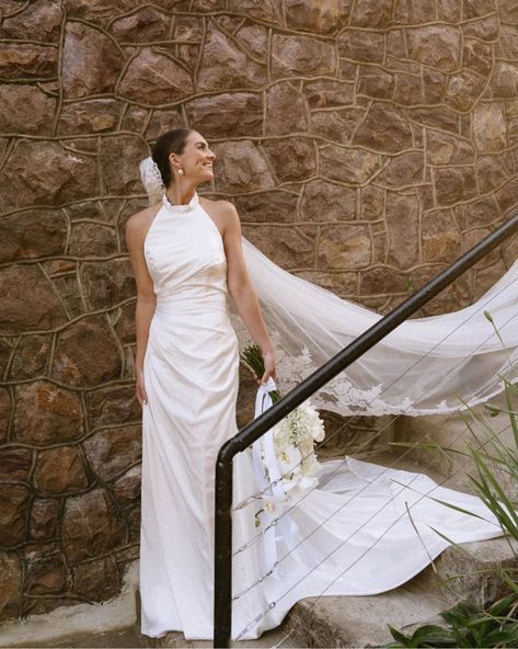 Draped luxury ✨️ How gorgeous are these photos by @skyekyraphotography from a recent styled shoot! This halter neck wedding dress, featuring a hand drapped bodice and skirt, with a low open back and tie detail at the waist. Made from luxurious silky satin, it hangs effortlessly. Perfect for your effortlessly chic aesthetic! Paired with this achrival veil from @veil_atelier and some stunning earrings from @olivecoral. The ever so talented @kiss.the.bride.hair.makeup did this absolutely fl... Halter Neck Wedding Dress With Veil, Halter Neck Wedding Dress, Dress With Veil, Draped Wedding Dress, Kiss The Bride, Halter Wedding, Halter Wedding Dress, Neck Wedding Dress, Wedding Dress With Veil