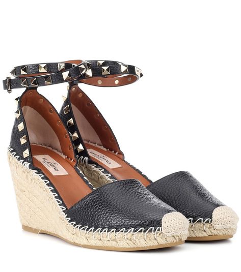 Valentino - Valentino Garavani Rockstud Double leather wedge espadrilles - Valentino Garavani's signature studs in a pale gold hue add instant appeal to any accessory, and on a wedge espadrille these embellishments look especially fresh. Crafted in Italy from black leather, this statement summer style sits atop a woven wedge platform and features an ankle strap for comfort. Wear with jeans and seasonal stripes for a new-season take on warm weather dressing. seen @ www.mytheresa.com Valentino Wedges, Valentino Heels, Valentino Garavani Shoes, Black Leather Wedges, Wedge Espadrilles, Black Espadrilles, Valentino Rockstud, Pale Gold, Leather Wedges