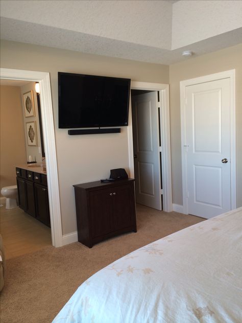 Master bedroom wall mounted tv with small cabinet underneath Tv Mounted On The Wall Bedroom, Tv Mount Bedroom, Tv Wall Mount Ideas Bedroom Small Spaces, Tv Mounted In Bedroom, Bedroom Wall Mounted Tv, Bedroom Tv Wall Ideas Small Spaces, Tv On Wall Bedroom, Bedroom Ideas Tv, Tv In A Bedroom