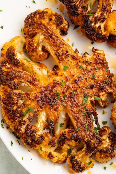 These cauliflower steaks are simply seasoned but absolutely delicious. Tender and packed full of flavor, they are the perfect vegan main course or an easy side dish. #vegan #easy #vegetables #cauliflower Cauliflower Cutlets, Cauliflower Side Dish, Cauliflower Steaks Recipes, Easy Vegetables, Roasted Cauliflower Steaks, Vegan Main Course, Roasted Cauliflower Recipes, Spiced Cauliflower, Pork Schnitzel