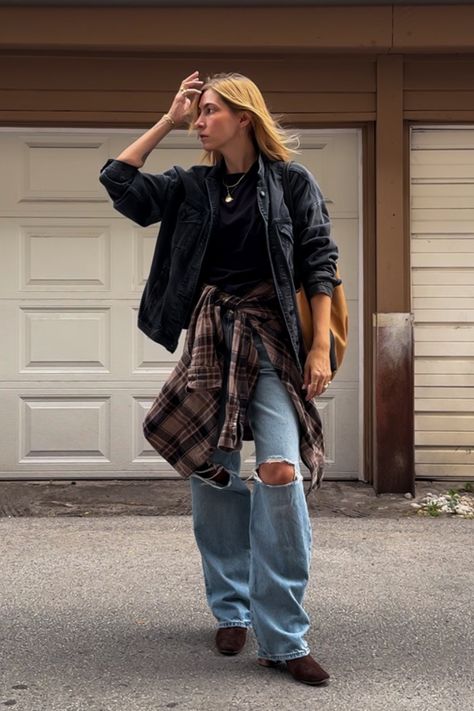 How to style black and brown together - pair earth tones with baggy ripped jeans, a suede boot and tie a flannel around your waist #jeanjacketoutfit #blackandbrownoutfits #baggyjeans #falloutfitideas #falltrends #moodyoutifts #tomboyaesthetic #fallaesthetic • tomboy grunge outfits • how to style a flannel shirt for fall • black denim jacket outfit • oversized outfits • modern grunge outfit • flannel tied around waist outfit • suede boots for fall •  fall trends • Ripped Denim Jacket Outfit, Jean Jacket And Flannel Outfit, Hoodie Under Flannel, Flannel Tied Around Waist Outfit, Tie Around Waist Outfits, Grunge Outfits Oversized, Flannel Around Waist Outfit, Flannel Tied Around Waist, Baggy Flannel Outfit