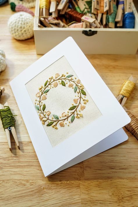 Folded Greeting Card with embroidered autumn leaves wreath in the middle. Greeting Card Embroidery, Cards Embroidery, Book Embroidery, Fall Greeting Cards, Wreath Embroidery, Holiday 2022, Lansing Mi, Book Marks, Autumn Wreath