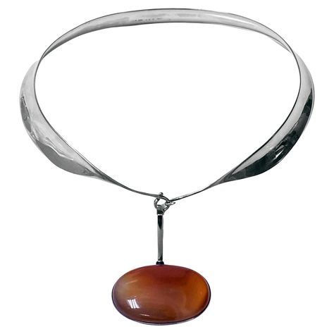 Vivianna Torun Bulow Hube for George Jensen, a rare Sterling Silver Necklace with reddish brown banded agate detachable pendant on collar, Denmark, C. 1975, stamped Georg Jensen in a dotted oval, Denmark, Torun, 133 pendant and 160 collar and 925S. Will fit up to 16 inch neck, pendant drop approximately 2.75 inches, width of agate 2 inches. Item Weight: 123 grams. Ref: The Jewellery Box Jens Ingvordsen P.275. Vivianna Torun Bülow-Hube know as Torun, was born 1927 in Malmo, Sweden. Torun was the George Jensen, Red Agate Necklace, Neck Pendant, Detachable Pendant, Dope Jewelry Accessories, Billie Holiday, Malmo, Dope Jewelry, Banded Agate