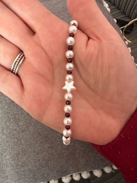 beautiful star bracelet made with faux pearls, garnets and a star bead.  for every bracelet I sell £1 will be donated to the stroke association. Pearl Bracelets Ideas, Pearl Bead Bracelet Ideas, Beading Aesthetic, Bead Bracelets Aesthetic, Pearl Bracelet Ideas, Inspo Bracelets, Aesthetic Bracelet Ideas, Star Beaded Bracelet, Aesthetic Bracelets