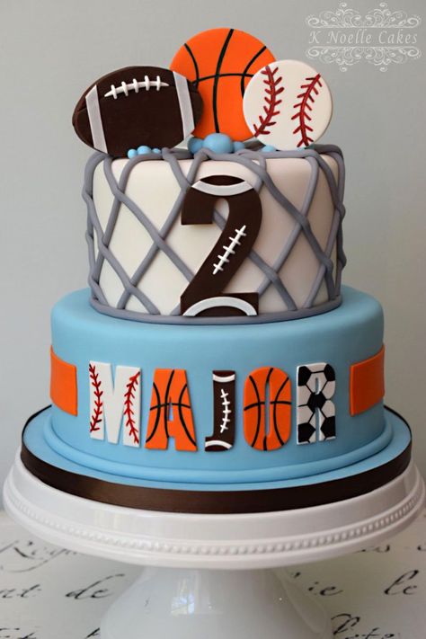 Sports theme 2nd birthday cake by K Noelle Cakes Sports Themed 2nd Birthday Party Ideas, Second Birthday Sports Theme, All Sports Birthday Cake, Sports Themed Birthday Cakes For Boys, Ball Theme Cake 2nd Birthday, Sports Theme Cakes Boys, Sport Theme Cake, Two Year Old Sports Birthday Party, Sports Birthday Cakes For Boys