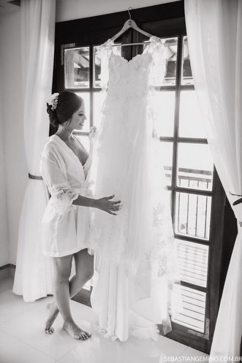 Foto de noiva no making of com seu vestido de noiva. #vestidodenoiva #weddingparties #pre #wedding #parties Wedding Preparation Photos, Wedding Dress Hanging, Love Citation, Bride Preparation, Bridal Photography Poses, Wedding Details Photography, Bridal Prep, Wedding Picture Poses, Bridal Poses