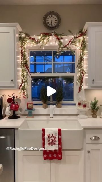 Rochelle Roos Ekman on Instagram: "✨🌲Loving our apron front sink update all through the year! Decked out with garland and twinkle lights makes this view just magical ✨  -Apron front sink @blancoamerica1 -Berry Eucalyptus Garland @michaelsstores   You can shop my home with links in my bio or by following me in the @shop.ltk app!   #garland #christmasdecor #modernfarmhouse #farmhousekitchen #homedecor #minneapolis #diydecor" Garland Over Kitchen Sink Window, Christmas Garland Above Kitchen Sink, Garland Around Window Christmas, Kitchen Window Garland, Garland Over Kitchen Window, Christmas Window Garland Indoor, Garland Around Kitchen Window, Christmas Kitchen Window Decor, Window Garland