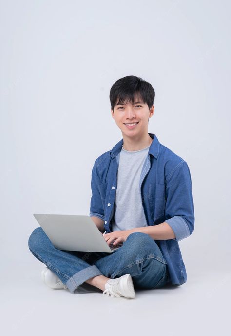 Premium Photo | Young asian man sitting and using laptop on white background Sitting In Desk Reference, Male Office, Pose Photography, Face Swap, Asian Man, Element Design, Draw The Squad, Image Memes, Face Swaps