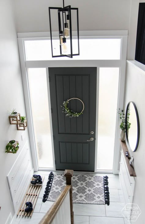 DIY Split Level Entry Makeover- I LOVE this entry. The oversize door, scandi influence and that shoe storage! Exterior Entryway Ideas, Split Foyer Remodel, Split Level Entry, Split Entry Remodel, Raised Ranch Remodel, Split Level Entryway, Split Level Remodel, Split Foyer, Ranch Remodel