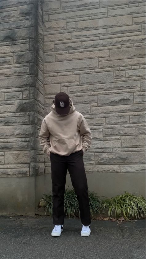 A simple streetwear outfit featuring neutral colors. The outfit includes a brown San Diego Padres hat, a khaki oversized hoodie from Rue Porter, brown Dickies 874 pants, and white Nike blazer mid 77’ sneakers with the black swoosh. Nike Hoodie Men Outfit, Fits With Nike Blazers Men, Light Brown Hoodie Outfit Men, Neutral Men Outfit, Neutral Outfits For Men, Tan Hoodie Outfit Men, Brown Crewneck Outfit Men, Nike Blazer 77 Outfit Men, Tan Outfit Men