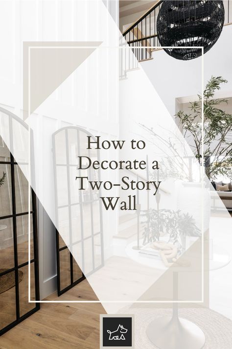 Learn about creating a gallery wall for visual interest. This pin provides tips on designing an expansive gallery wall with a mix of art pieces, photos, and decorative items, creating a dynamic and personalized focal point that draws the eye upward. What To Do With A Tall Blank Wall, Tall Wall Decor High Ceilings Office, 2 Story Gallery Wall, 2 Story Great Room Ideas Wall, Tall Wall Gallery Ideas, Decor For High Wall Space, Vaulted Ceiling Artwork, Double Height Foyer Wall Design, 2 Story House Decorations Ideas