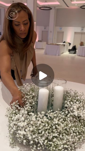 Flowers 🌺 By G Bella- Wedding Stylist|Floral Designer on Instagram: "Remember those gorgeous baby’s breath table runner arrangements we highlighted last week? Well, we’re back to talk more details from that wedding because we are simply obsessed with how it all turned out 😍  This time, we want to highlight the complimentary round table centerpieces.   We kept it more minimal for the round tables and created wreaths out of baby’s breath with candle votives inside the wreaths. These airy arrangements not only complimented the longer tables’ elaborate designs but also added an ethereal charm to the reception space.   And here’s a quick #GBellaTuesday tip for you: Putting foam in the middle of the wreaths allows the candle votives to stand out amidst the baby’s breath, creating more harmony Babys Breath And Candles Centerpiece, Baby’s Breath Baby Shower Table Decor, Wreath Centerpieces Wedding, Table Runner For Wedding Reception, Baby’s Breathe Centerpieces, Floral Table Runner Centerpiece, Candle Wedding Centerpieces Round Tables, Round Mirror Centerpiece Ideas, Baby Breathe Center Piece Ideas