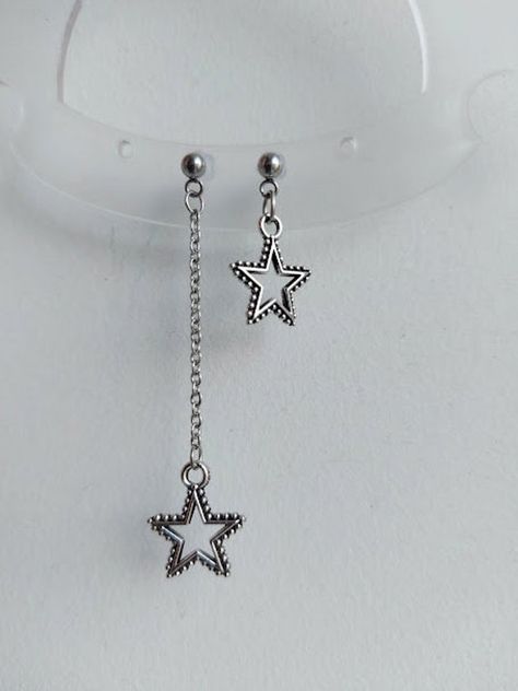 The earrings are adorned with a small star-shaped pendant. The earrings are fastened with stainless steel studs. Earring length - 7.0 cm (2.7 inches) Earrings  are packed in a gift box RECOMMENDATIONS FOR CARE: Do not wet, do not drop, and store in a dark box! - Remove jewelry before exercising, swimming, showering and sleeping. - Avoid contact with moisture such as make-up, moisturizer, lotion, perfume and hairspray. - Store your jewelry in a box or pouch after use. Cute Star Earrings, Edgy Star-shaped Pierced Earrings, Edgy Silver Star-shaped Jewelry, Edgy Star-shaped Earrings For Gift, Punk Style Star-shaped Metal Earrings, Star-shaped Earrings With Adjustable Chain As Gift, Earrings Grunge, Silver Star Earrings, Gothic Earrings